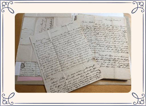 papers and documents with old handwriting on a desk